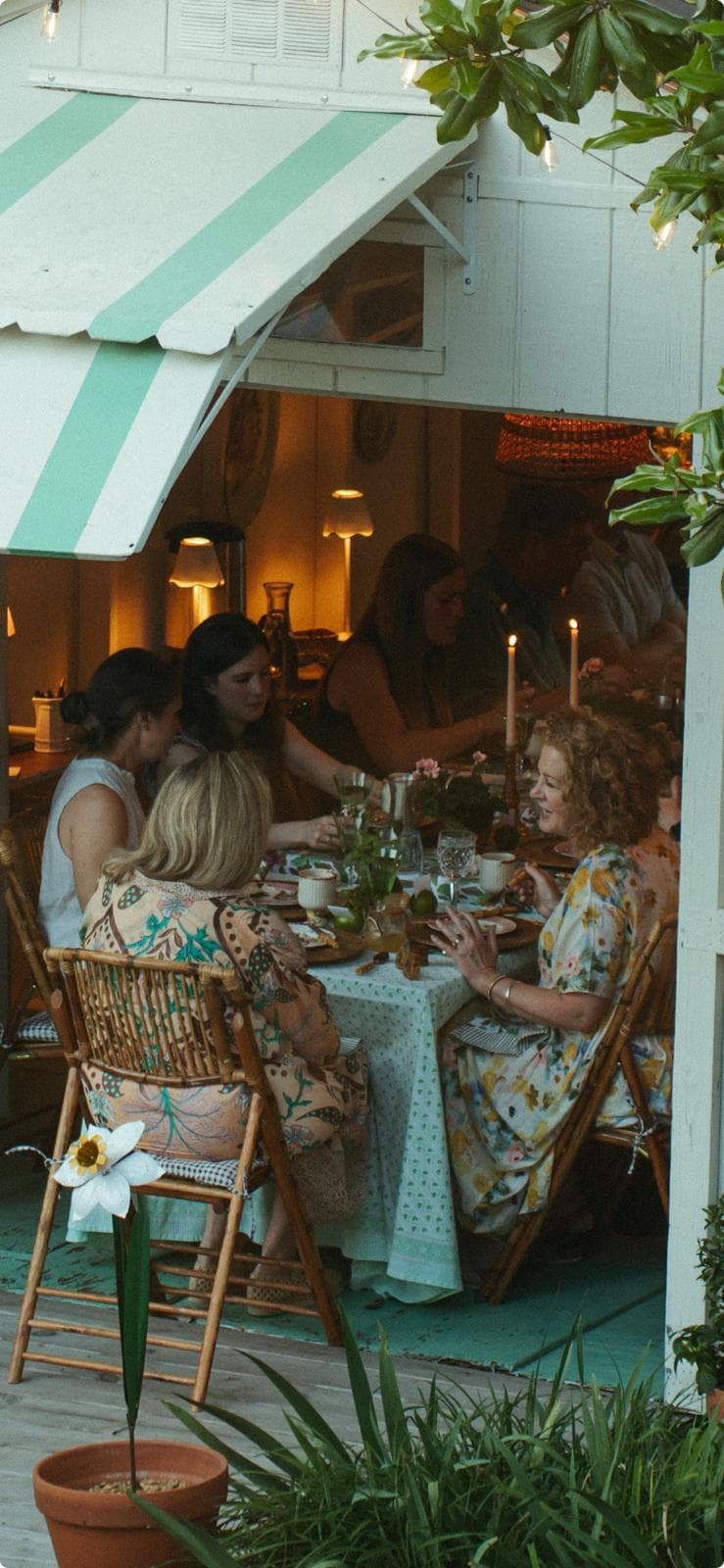 Guests gathered around the table at a private e's supper club dinner